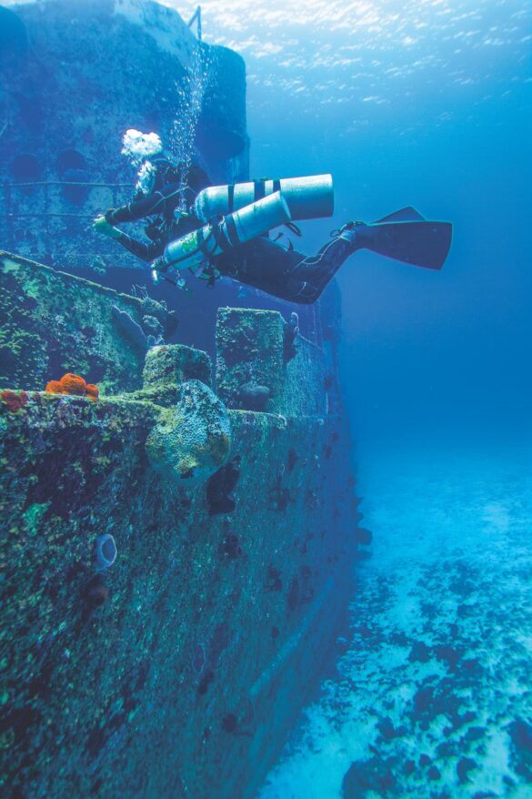 A Diver Checking a Sunken Ship A Diver Checking a Sunken Ship