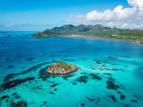 Aerial View of Rocky Islet Crab Cay Off the Coast of the Colombian Island Providencia in the Turquoise Caribbean Sea Aerial View of Rocky Islet Crab Cay Off the Coast of the Colombian Island Providencia in the Turquoise Caribbean Sea