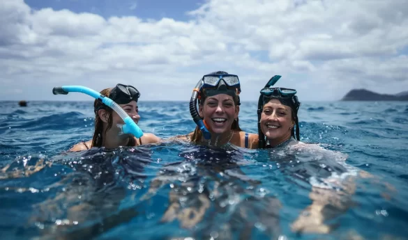 Group of people in mask and snorkel laughing in water Group of people in mask and snorkel laughing in water