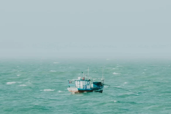 Fishing Boat Sailing in Rough Sea on a Misty Day Fishing Boat Sailing in Rough Sea on a Misty Day